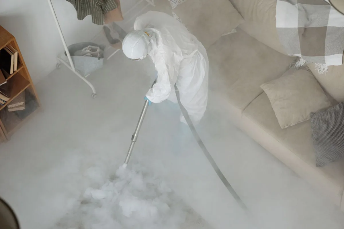 Biohazard cleanup technician in protective equipment, Tomahawk, WI